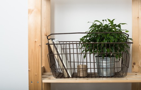 Simple minimalist furniture, wooden shelf with home interior decor.の写真素材