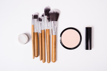 Professional makeup brushes and tools, make-up products kit, flatlay on white background