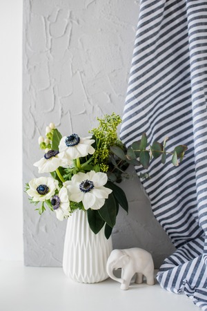 Still-life with an elegant bouquet of anemonesの写真素材