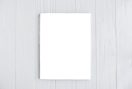 magazine cover mock-up on white wooden tableの写真素材