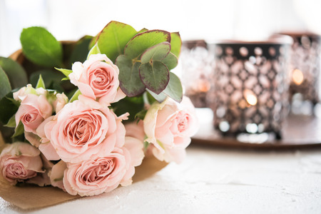 bouquet of roses and candlesの写真素材