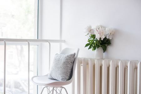 vintage home decoration, fresh peonies and designers chair withの写真素材