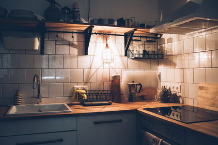 vintage white kitchen interior, cooking objects with warm lightの写真素材