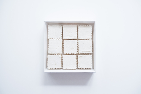 Square marshmallows in a boxの写真素材
