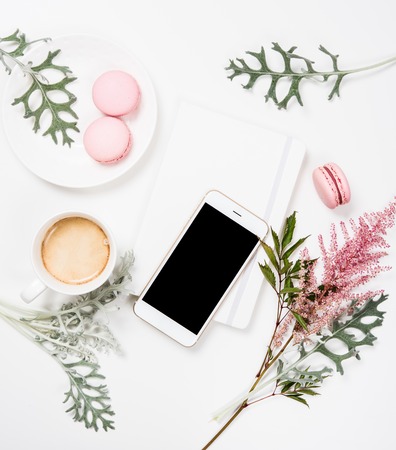 Social media flat lay with coffee, flowers and smartphoneの写真素材