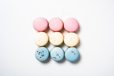 Colorful assorted macaroon cookies on white backgroundの写真素材