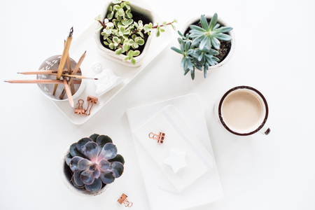 office desk flat lay with coffe, notepads and succulents, cleanの写真素材