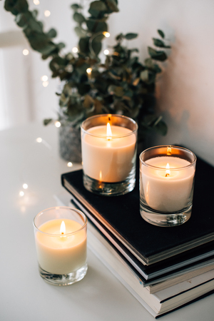 Cozy home interior decor, burning candlesの写真素材