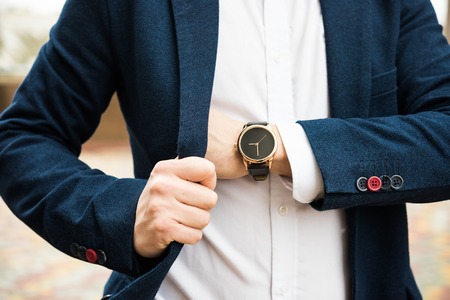 Elegant man in blue suit, business mans hand with fashion