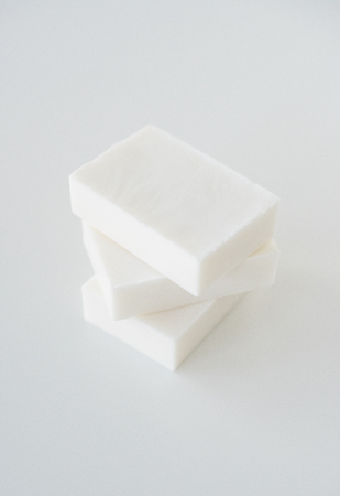 White handmade soap bars on white tableの写真素材