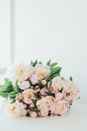 Vintage peony bouquet on white tableの写真素材