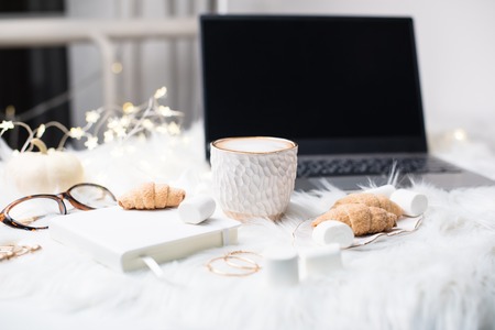 Lady bloggers white work place with business details, laptop, coの写真素材