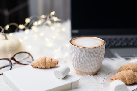 Lady bloggers white work place with business details, laptop, coの写真素材