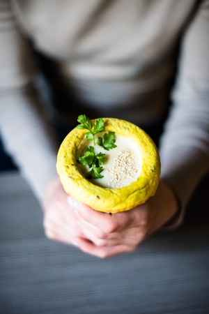 Woman holding healthy vegan street food in her handsの写真素材