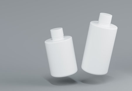 Two plastic shampoo bottles floating on gray background 3D render mockupの写真素材