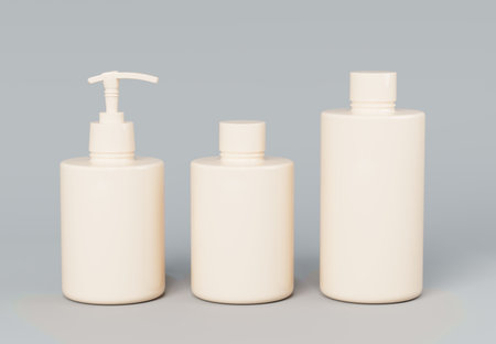 Three different beige cosmetic product bottles set template on gray background 3D renderの写真素材