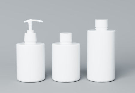 Three different white cosmetic product bottles set template on gray background 3D renderの写真素材