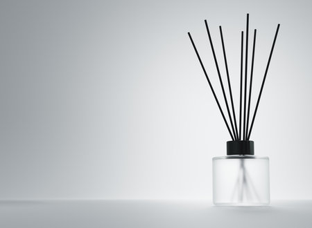 Aroma diffuser frosted glass bottle with black cap and sticks 3D renderの写真素材