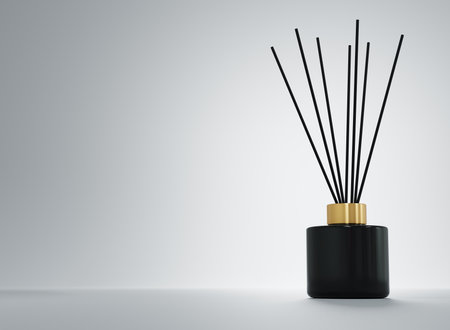 Aroma diffuser black ceramic bottle with gold cap and sticks 3D renderの写真素材