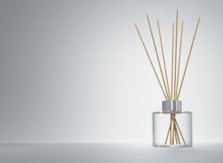 Aroma diffuser clear glass bottle with silver cap and wooden sticks 3D renderの写真素材