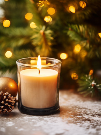 Holiday candle commercial, front view of burning candle in glass jar mock-up on Christmas background with winter decorations and bokehの素材