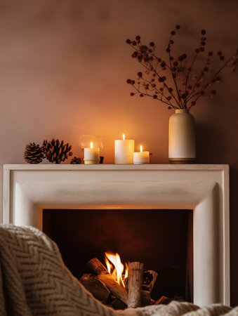 Beige and brown home interior decor, winter seasonal cozy apartment decoration with burning candles and empty wall, copy spaceの素材