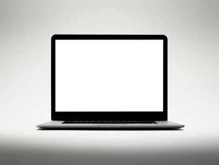Laptop screen mockup, white isolated empty computer screen, open laptop standing on simple studio backgroundの素材