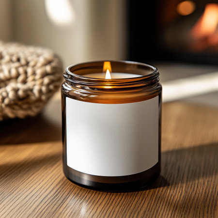 Amber glass candle in country house home interior, candle jar label mockup, cozy lifestyle candle branding templateの素材