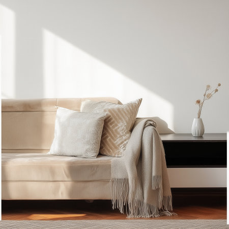 Elegant European living room with cozy sofa, throw pillows and minimalist decor, blank white wall with highlightsの素材