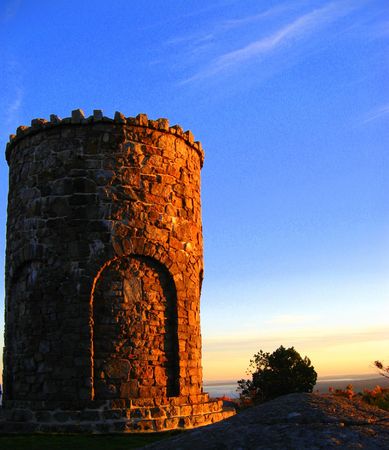 Stone observation tower near Camden, Maine at sunsetの写真素材