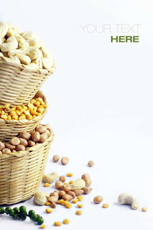 3 kinds of beans in rattan basket over white background with sample textの写真素材