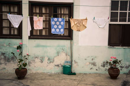 Laundry dries on a clothesline. Old fashioned clothes on a clothesline.の写真素材