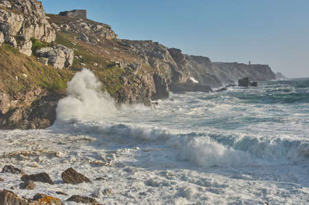 Rough sea at the coastline in FinistÃ¨re, France. Big waves breaking on cliffs in Crozon, France.の写真素材