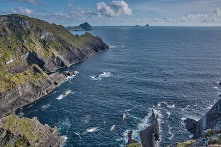 Beautiful coastline at the Ring of Kerry, Ireland. Huge cliffs at the Ring of Kerry Ireland. View on the Skellig Islands, Ireland.の写真素材