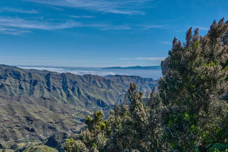 Panoramic landscape on La Gomera, Spain. Panoramic mountain landscape in La Gomera. Jungle-like landscape on the canary islands. Panoramic view on La Gomera and Tenerife.の写真素材