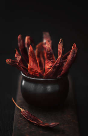 dry red chili peppers on a black wooden table. High quality photoの写真素材