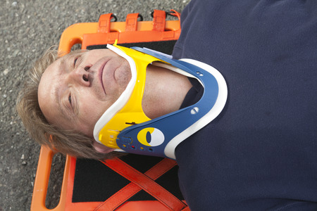 Paramedic employee with ambulance in the background.の写真素材