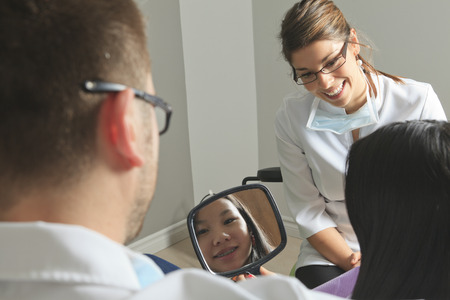 A dental office with employee and clientの写真素材