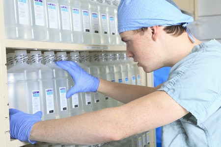 Medical staff sterilizing hands and arms before surgery