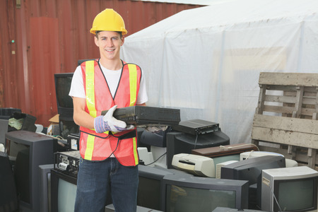 A worker who recycling thing on recycle center