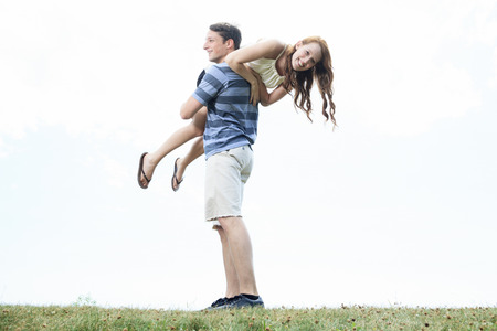 A couple outside having fun together outsideの写真素材