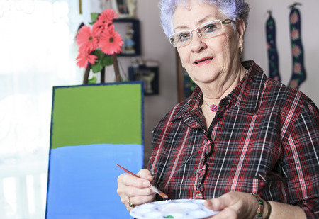 A Portrait of a happy senior woman at homeの写真素材