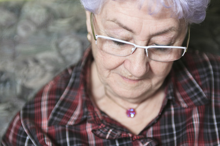 A Portrait of a happy senior woman at homeの写真素材