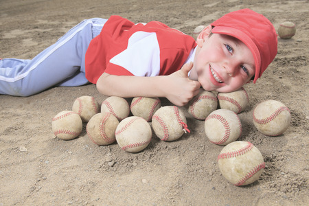 A nice child happy to play baseballの写真素材
