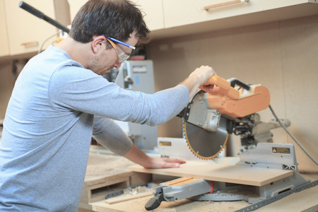 A Carpenter working hard at the shop