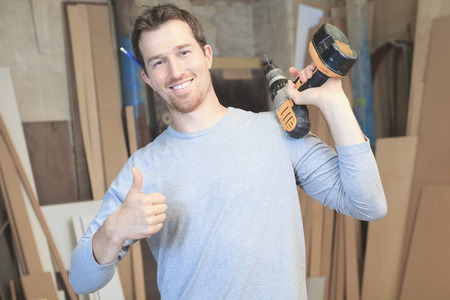 A carpenter working hard at the worksopの写真素材