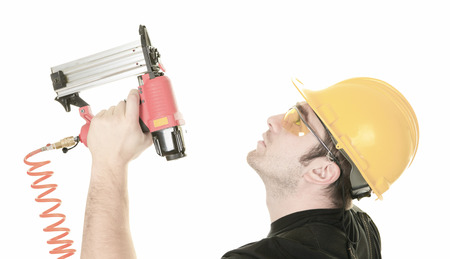 an experienced men carpenter in studio white 