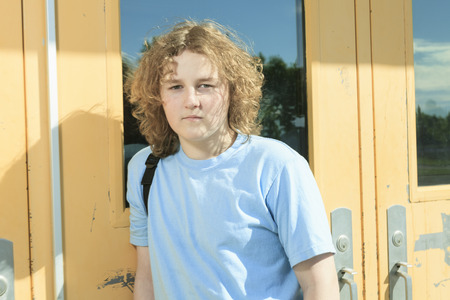 Secondary student on the playground of his school