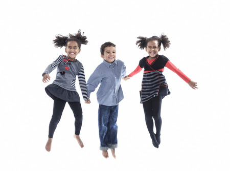 A cute african american little boy jump isolated on white backgroundの写真素材