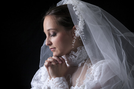 A old bride in a studio white backgroundの写真素材